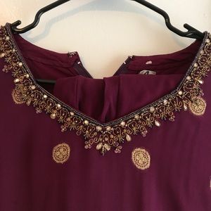 Purple salwar khameez with matching pants.